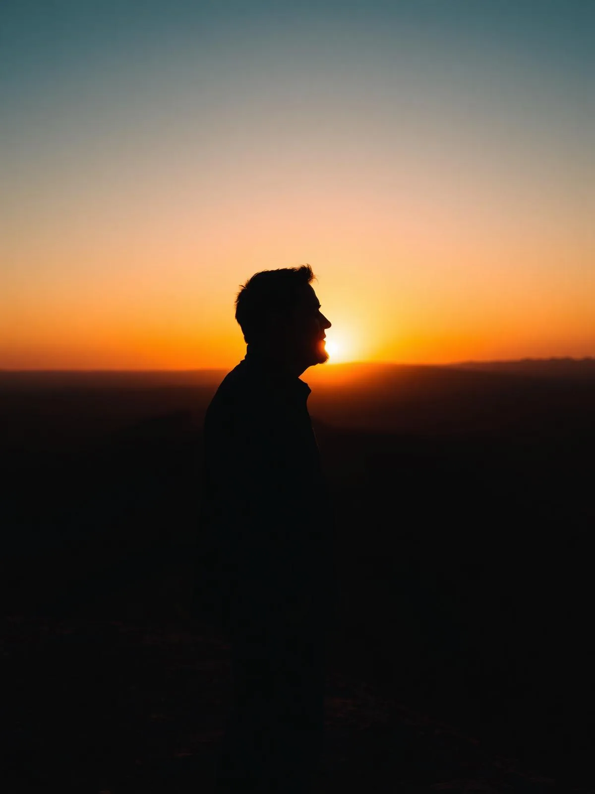 Steven Williams at sunset on a desert ridge